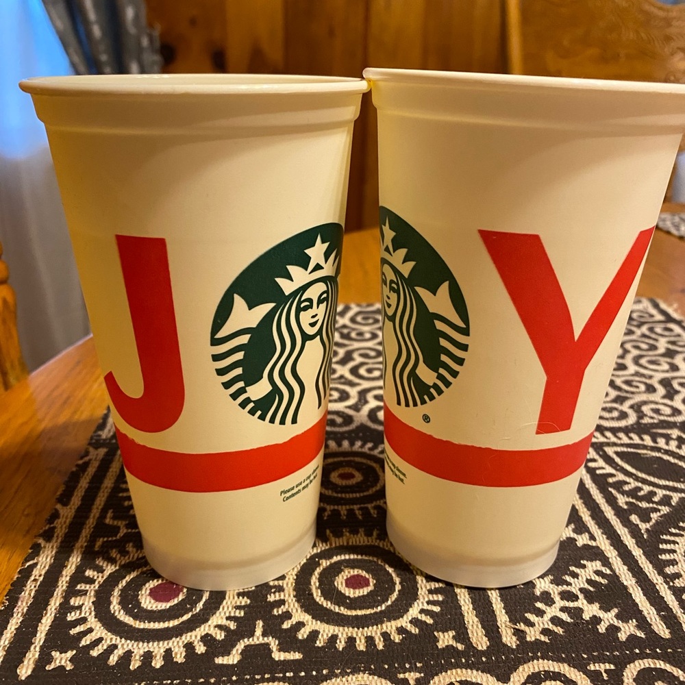 Two Starbucks 16 oz holiday themed reusable cups.